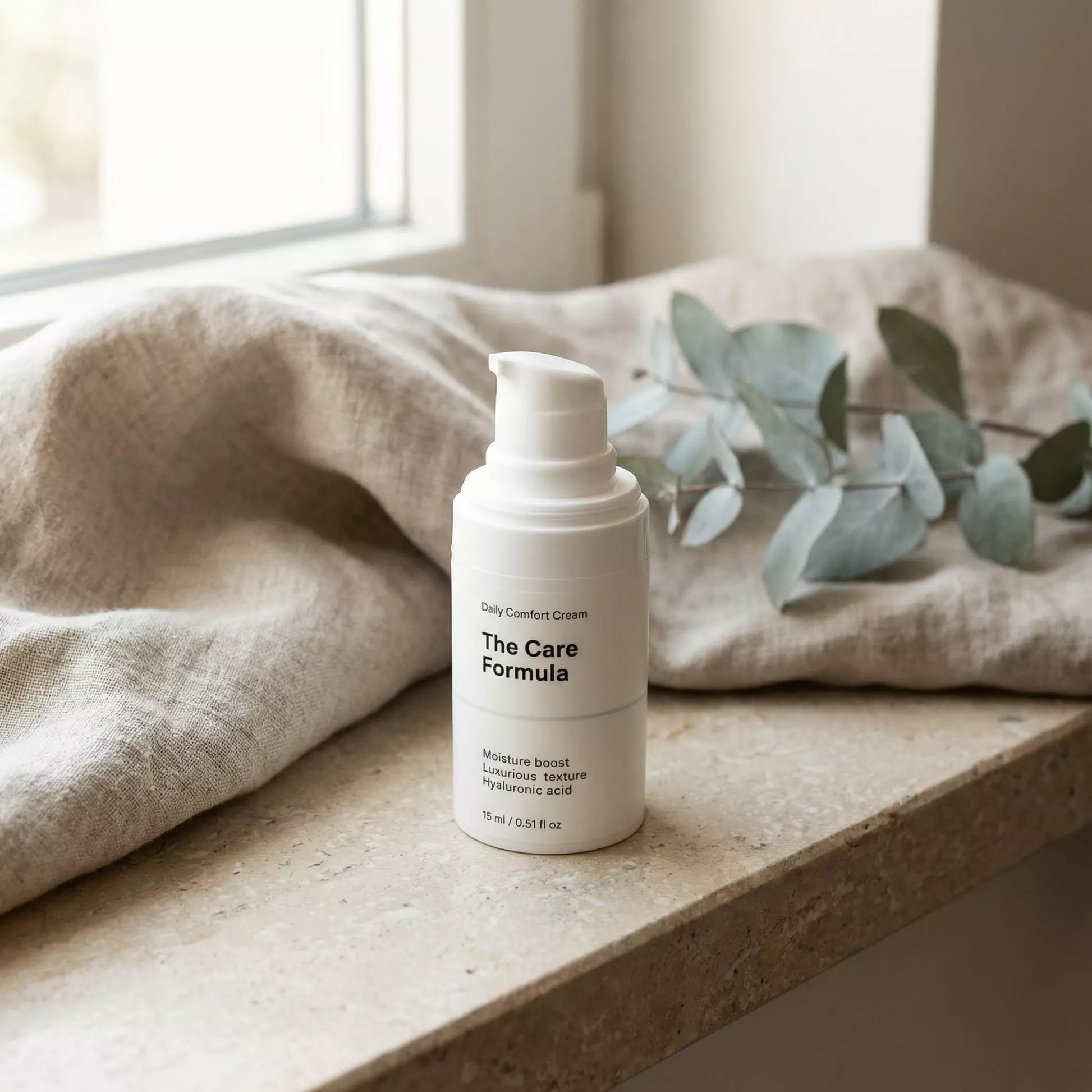 The Care Formula Daily Comfort Cream skincare moisturizer lifestyle scene on neutral stone surface