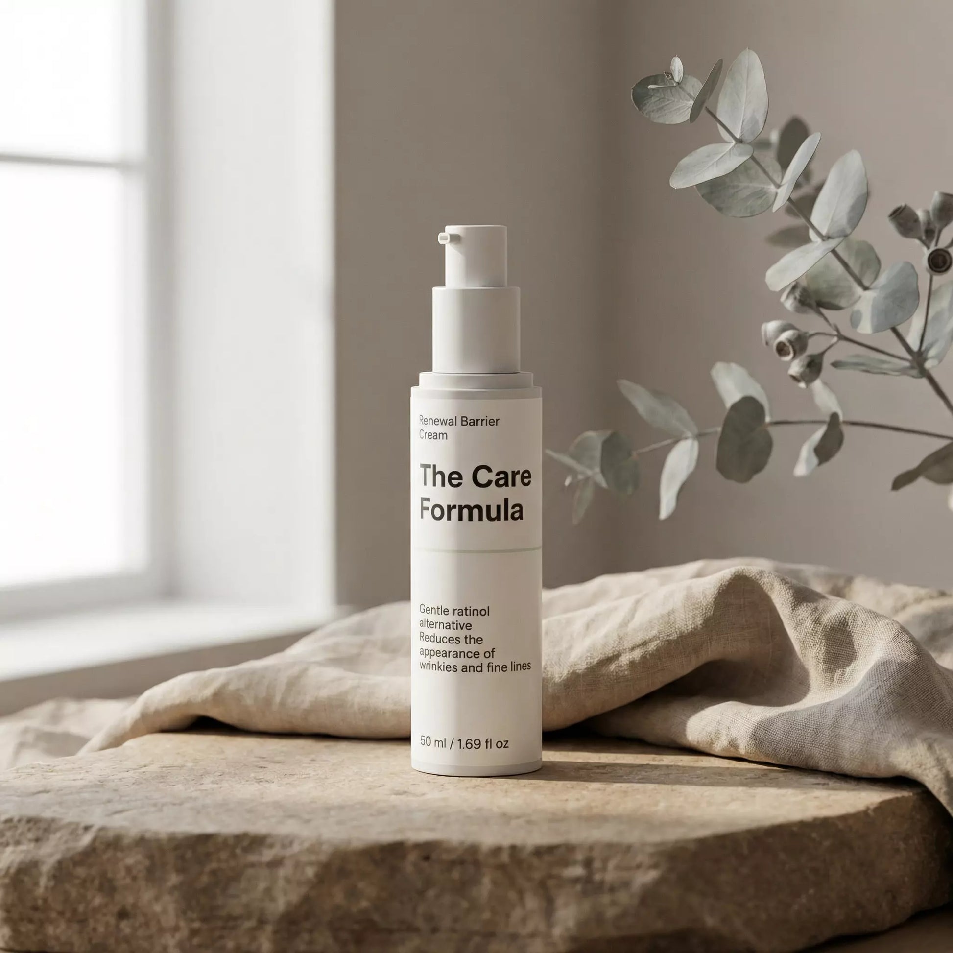 The Care Formula Renewal Barrier Cream lifestyle scene on a rustic stone surface by a window with eucalyptus