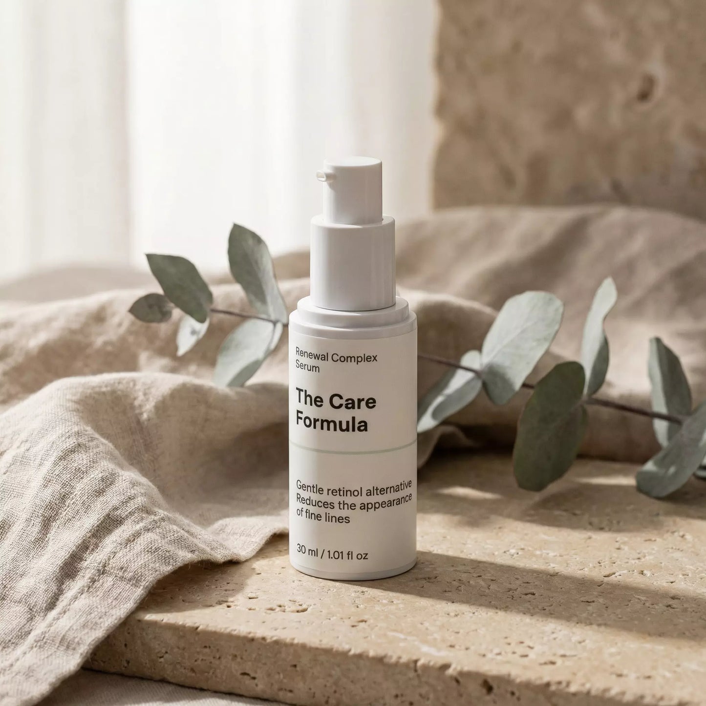 The Care Formula Renewal Complex Serum skincare product lifestyle scene on neutral stone surface