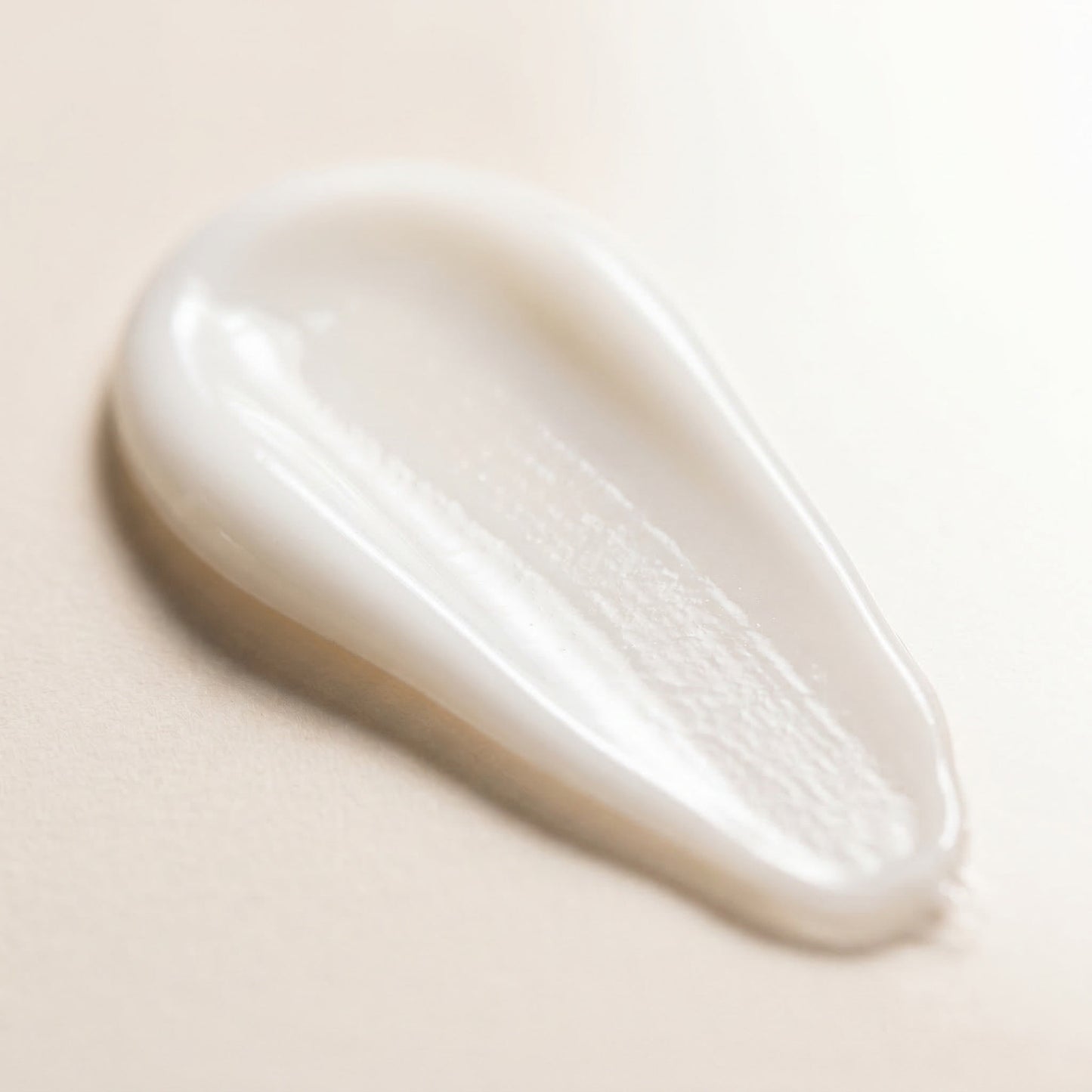 The Care Formula Renewal Eye Serum lightweight, silky white serum texture close-up