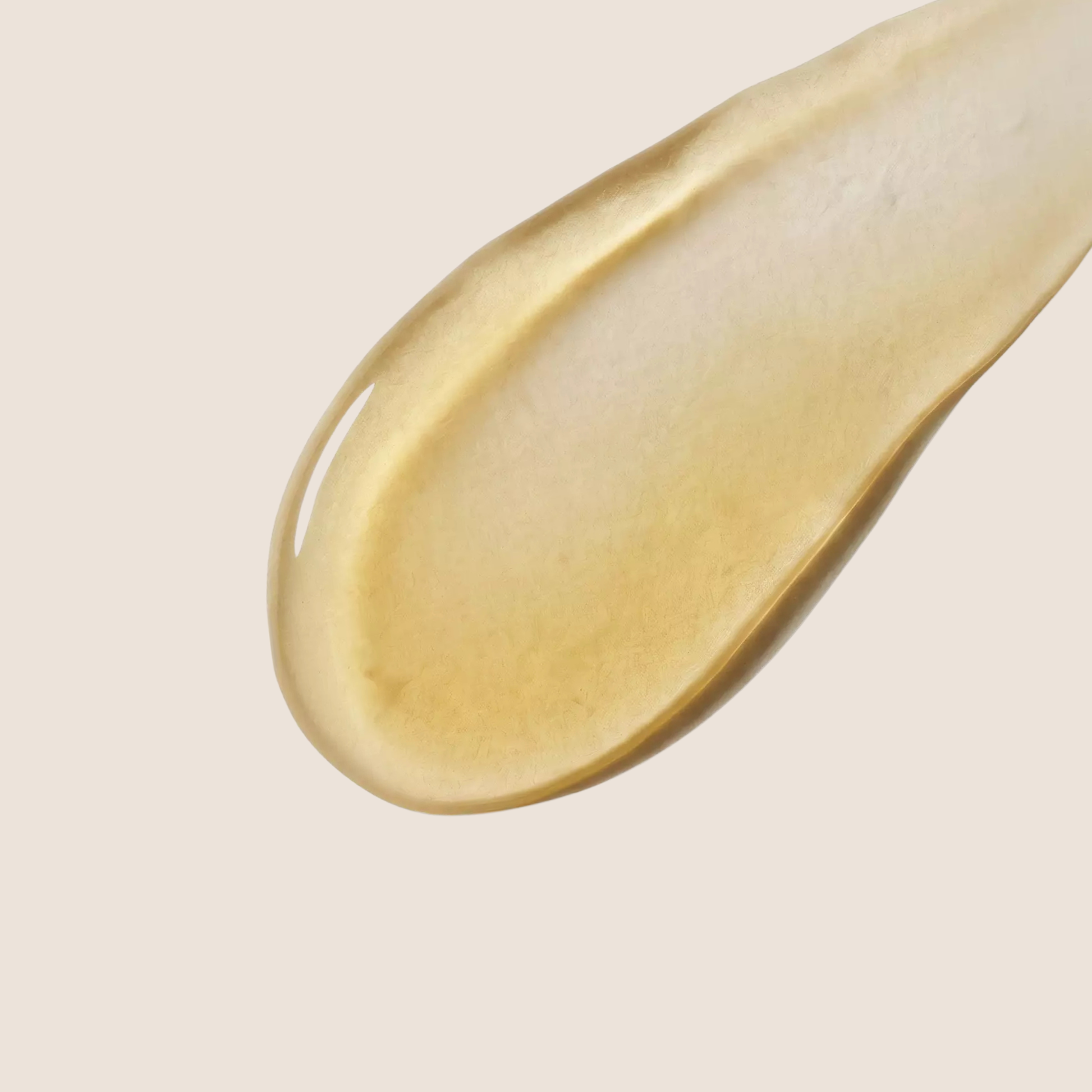The Care Formula Renewal Oil Serum in golden yellow oil texture close-up