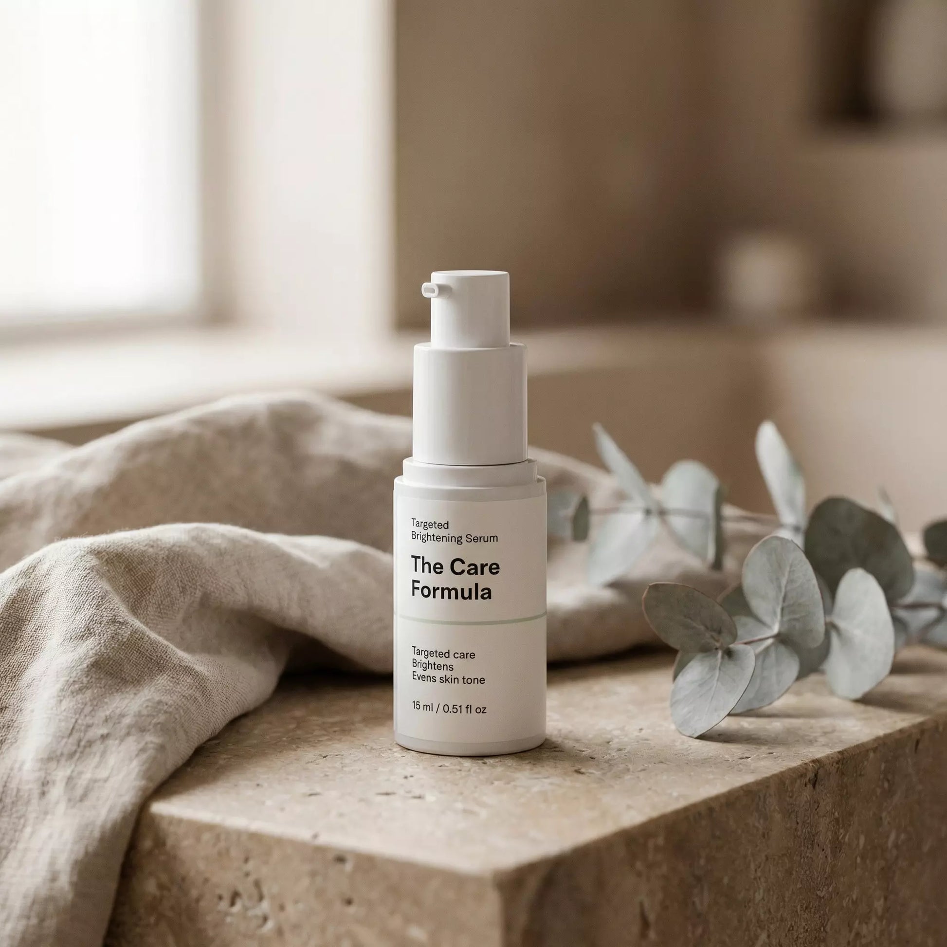 The Care Formula Targeted Brightening Serum skincare serum lifestyle scene on neutral stone surface