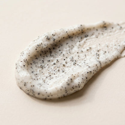 The Care Formula Volcanic Renewal Face and Body Scrub grain scrub texture close-up